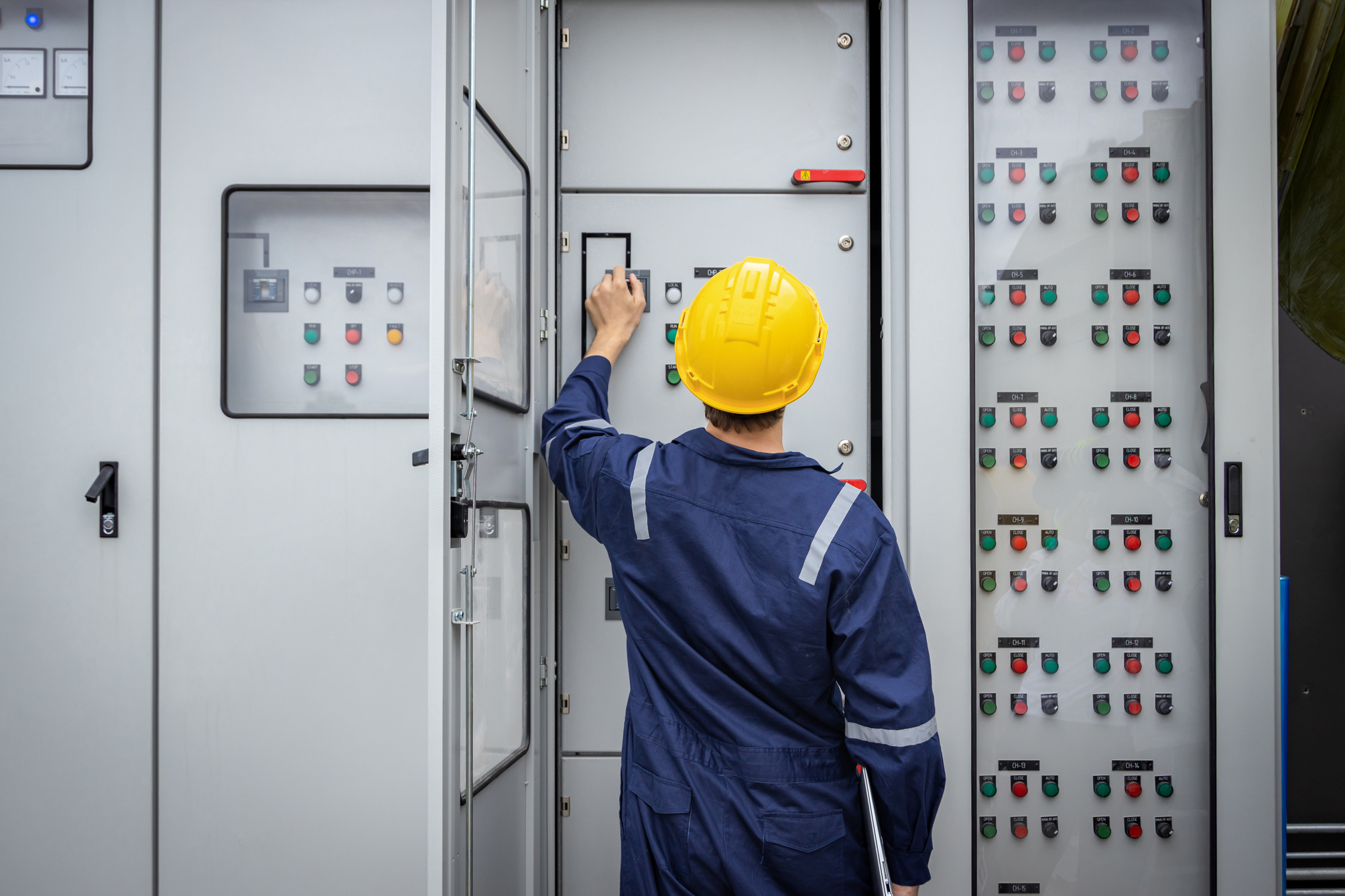 Electrical engineer working in control room. Electrical engineer